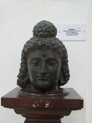 Peshawar Museum: Bodhisativa 2 c. A.D with curly hair., Pakistan 2008