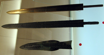 Bronze Swords and Axe-head Top is reproduction.  6th-5th C. B.C, Shanghai, Shanghai-Beijing 2008