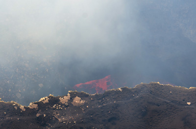 Smoky glimpses of red lava, Nicaragua: Masaya Volcano, Nicaragua, January 2020