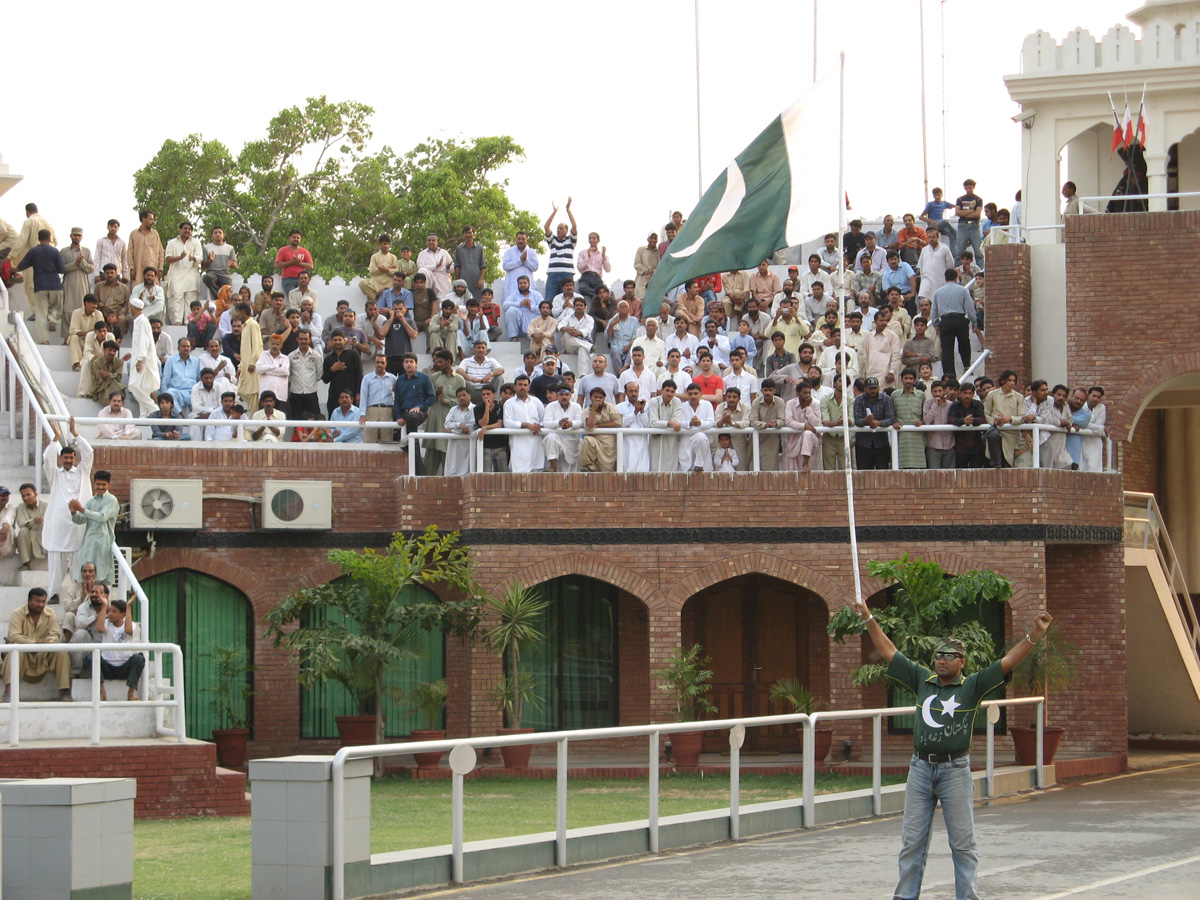 Wagha, A Pakistani warm-up flag waver With patriotic crowd.