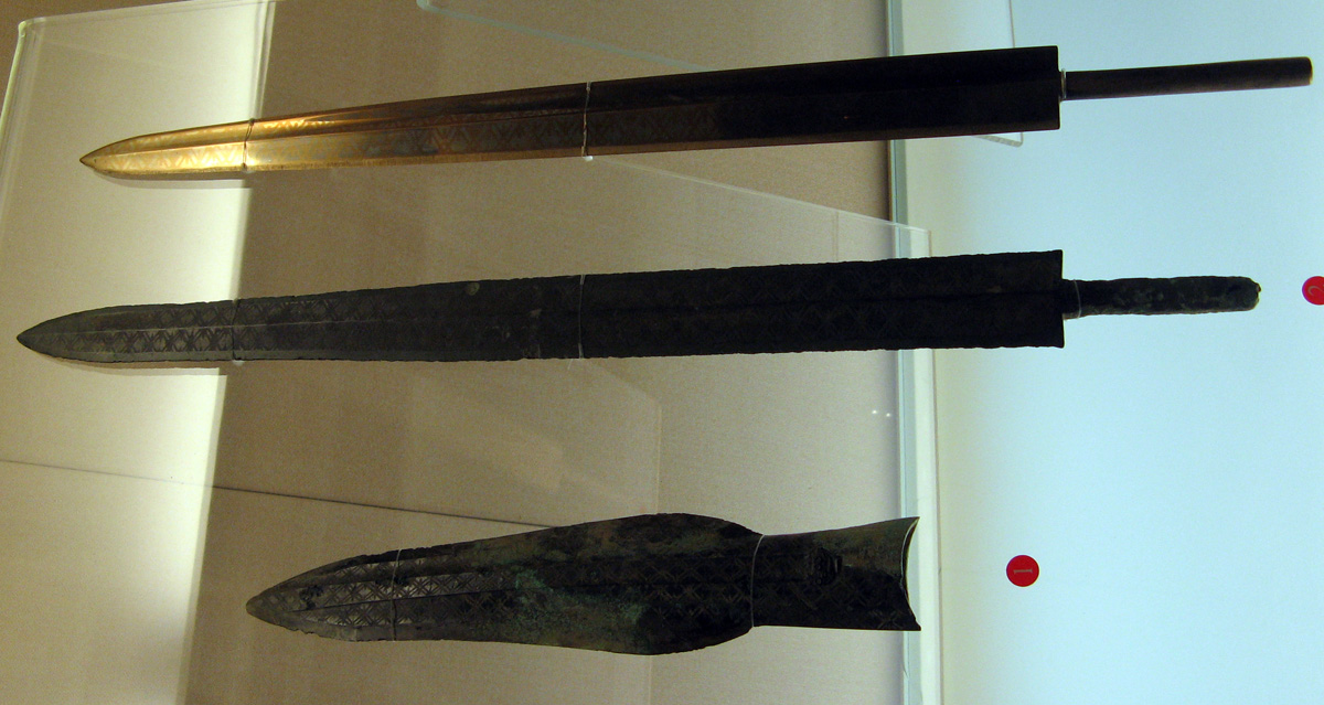 Shanghai, Bronze Swords and Axe-head Top is reproduction.  6th-5th C. B.C.