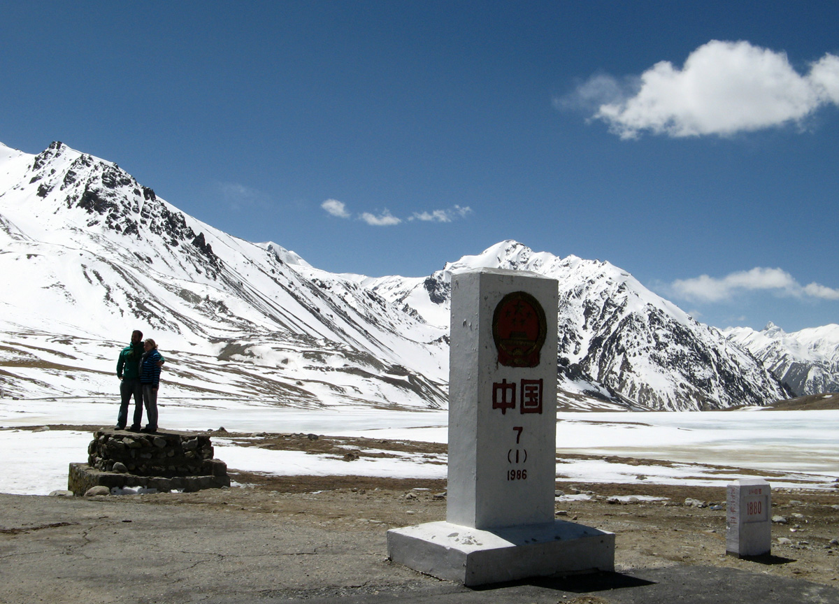 The KKH: Taskurgan to Khunjerab, Khunjerab Marker With Irish fellow travellers.