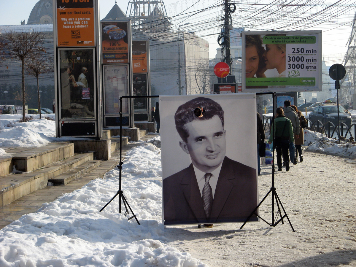 Bucharest, Commemoration of 1989? A photographer is snapping viewers from through the bullet hole.