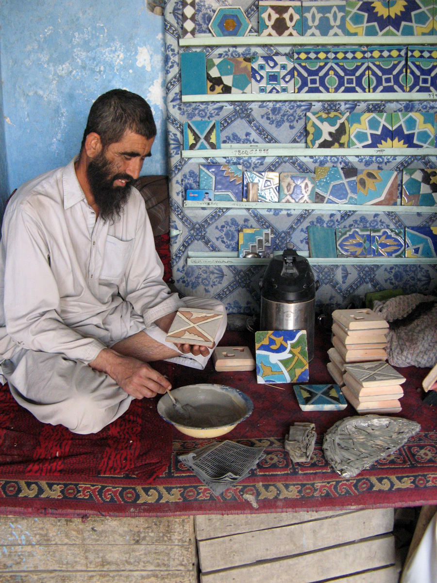Mazar-e Sharif, Tile Factory: Applying glazes Note scrap metals in foreground, to be ground down for glazes.