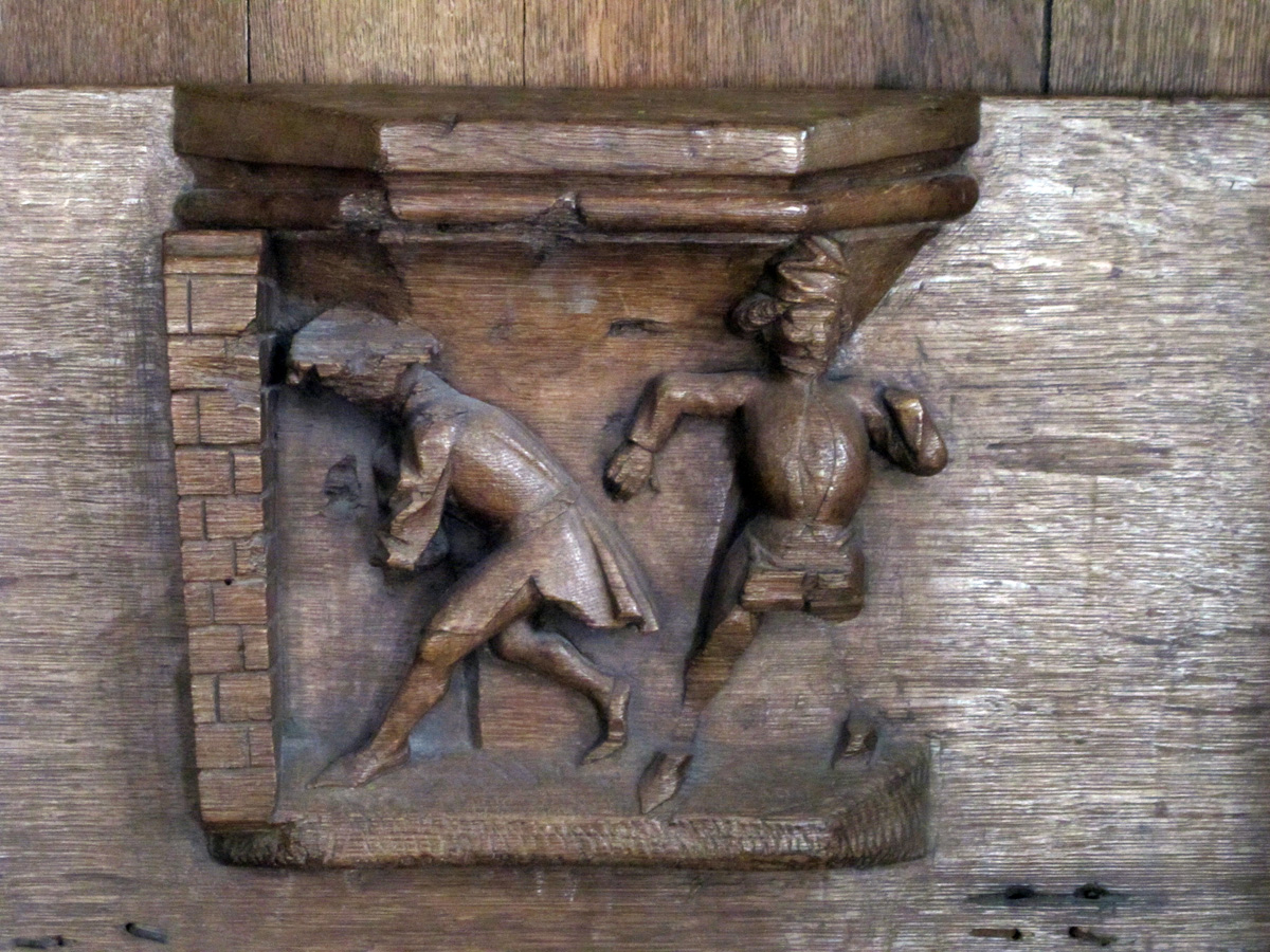 Amsterdam, Banging your head against a brick wall Oude Kerk, 1480 misericord