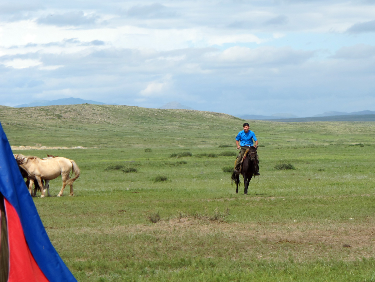 Central Mongolia, My guide, test-driving a horse. At stop for mare