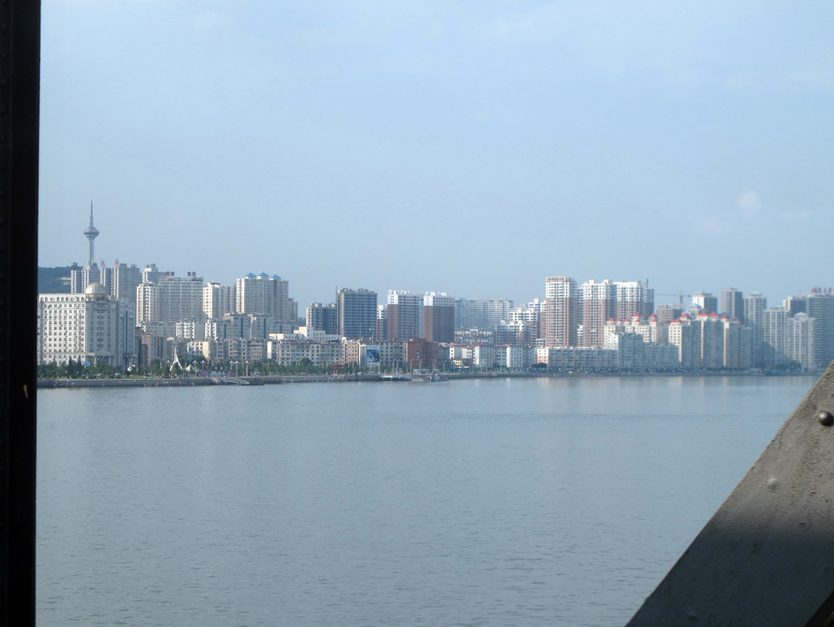 Exit, Crossing the DPRK-China border And approaching Dandong.