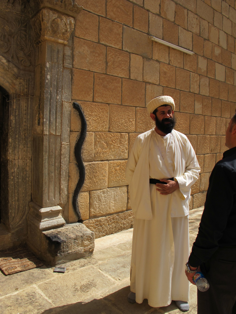 Lalish, Senior Yezidi Note black snake beside doorway.