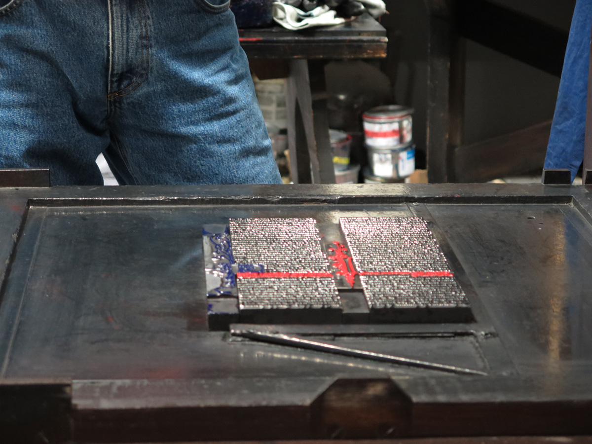 Mainz, Assembling black and red type sections. Which had just been separately inked.