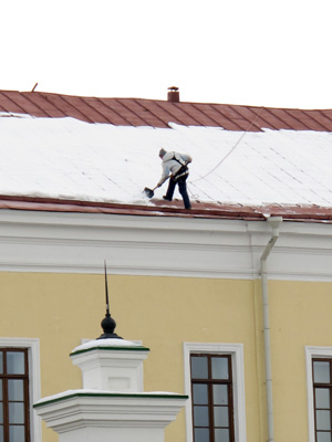 Clearing snow off the roof., Kazan, 2013 Volga Cities