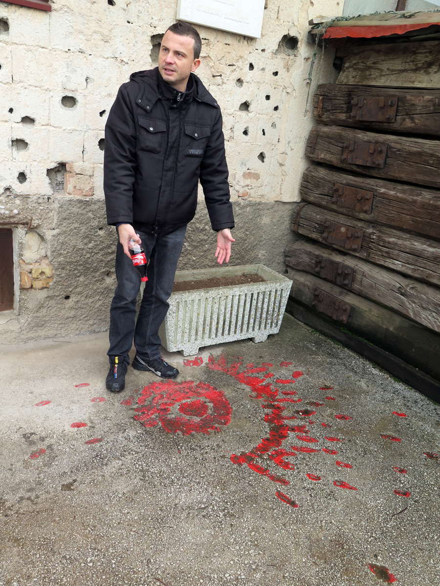 Tunnel Museum, Guide + "Sarajevo Rose", marking a missile hit