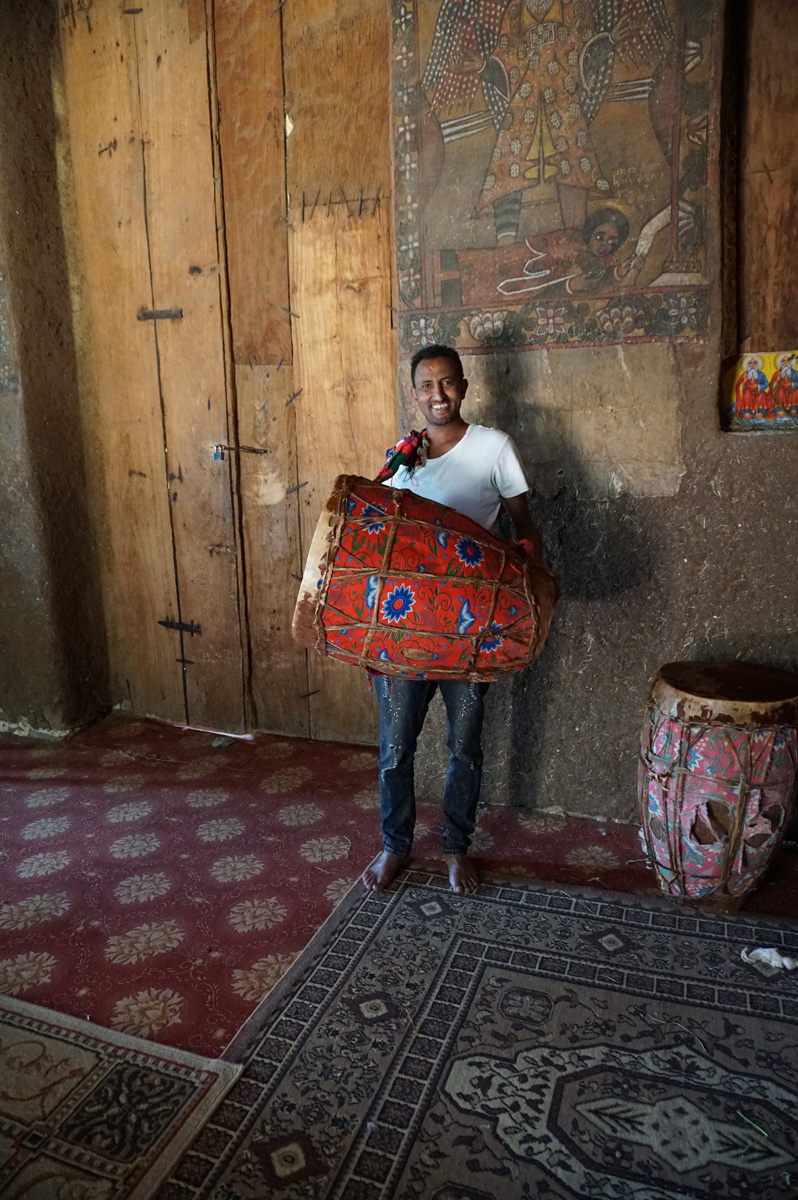 Debre Birhan Selassie Church, Guide with drum