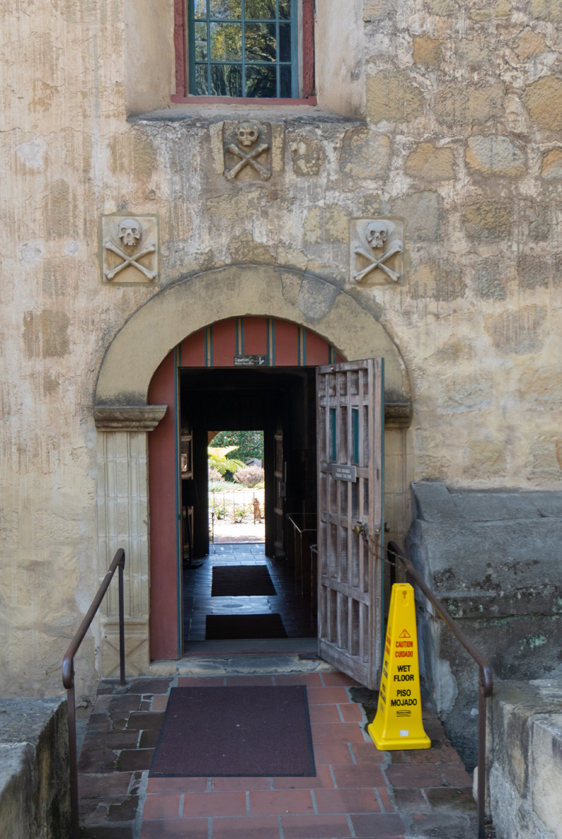 Mission Santa Barbara, Mission entry from Churchyard Note the Skull and Crossbone motif