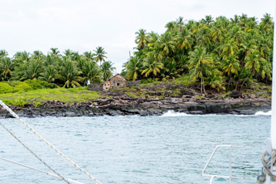 Devil's Island "Dreyfus Cabin" from catamaran, Îles du Salut, French Guiana++, December 2022