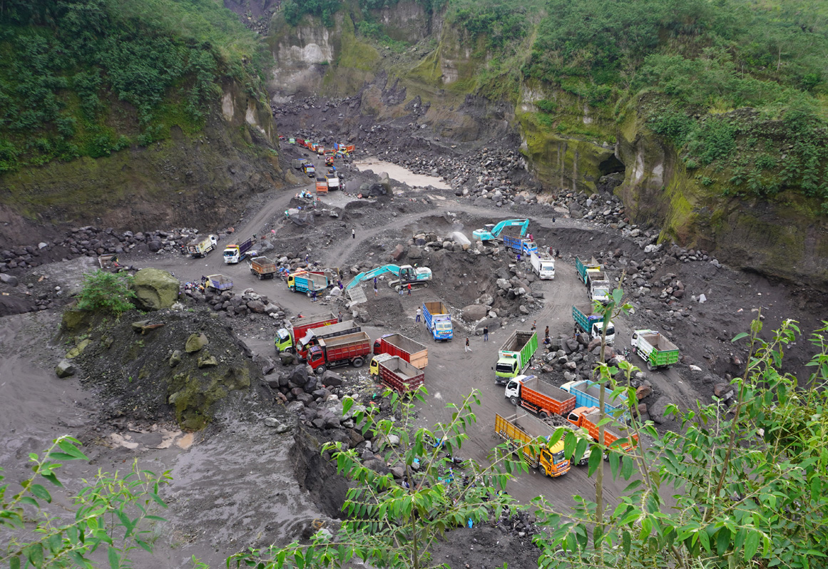 Merapi Volcano Jeep Tour, Trucks collecting still-hot ash for construction projects