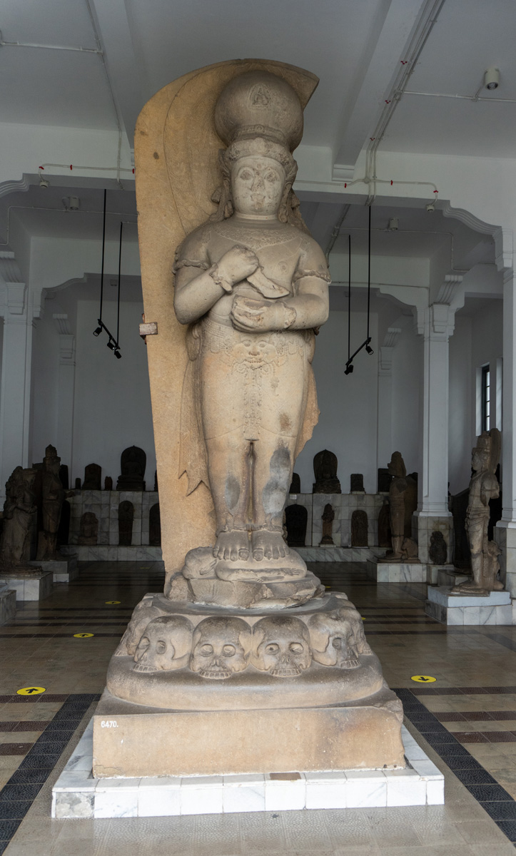 Merdeka Square area, "Bhairawa Buddha" 13-14th c Note plinth of skulls.