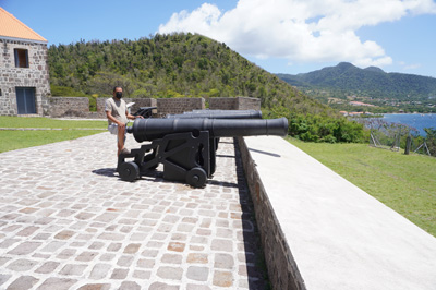 Guide "Martin" with cannon, Fort Shirley, 2022 Dominica