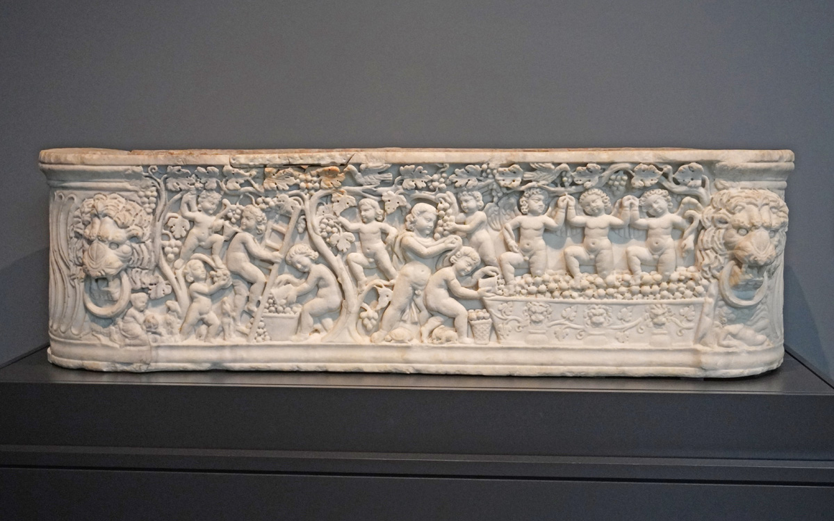 The Getty Villa, Sarcophagus: Cheerful cupids make wine.  ~300AD