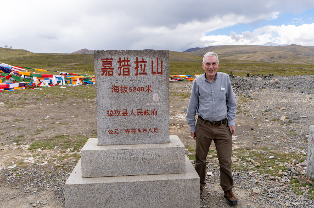 Shigatse to Shegar, Graham at Gyatso La pass The sign says 5248m, my GPS said 5195m (17044ft)