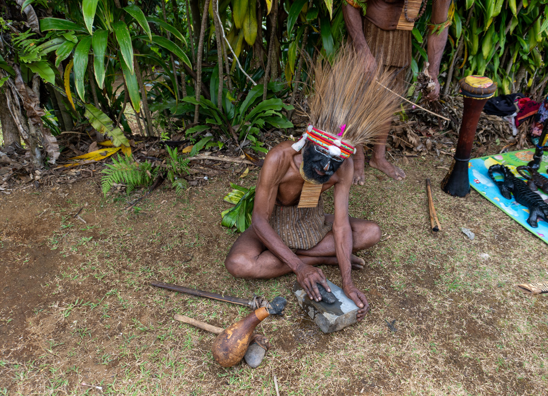 Rondon Ridge Day One: Cultural Shows, Grinding a stone axe head