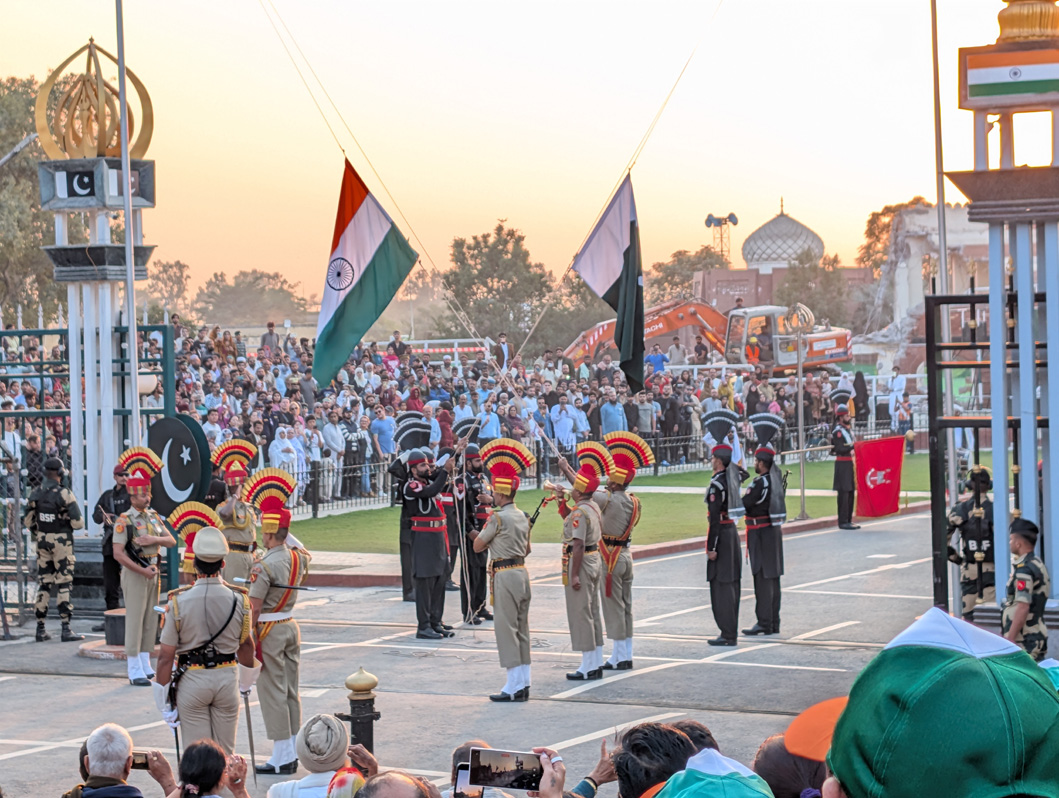 Wagah Border Ceremony, Finally, the flags are lowered, in carefully synchrony