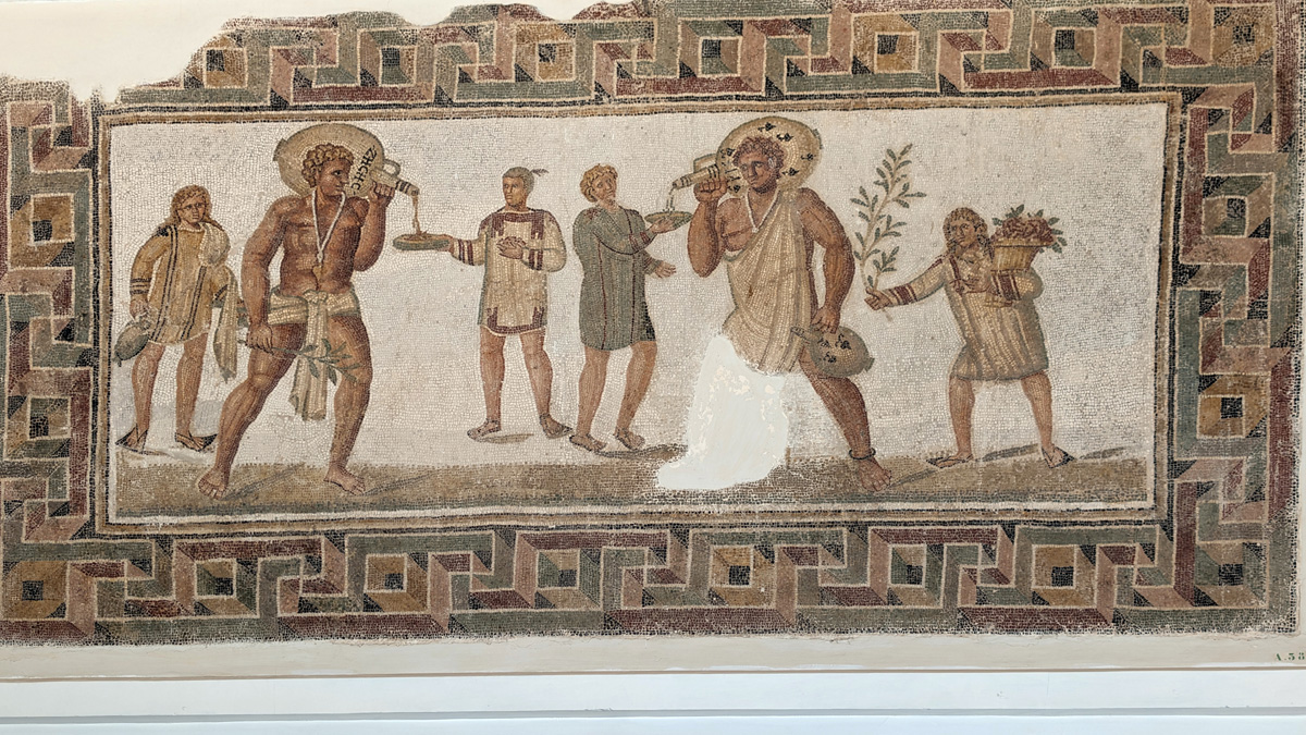 Bardo Museum Mosaics, Cryptic drinking scene (3rd c AD) Why are the wine bearers shown as giants?