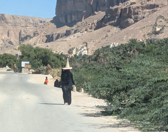 Woman in traditional farming hat, Wadi Do'an, 2025 Yemen